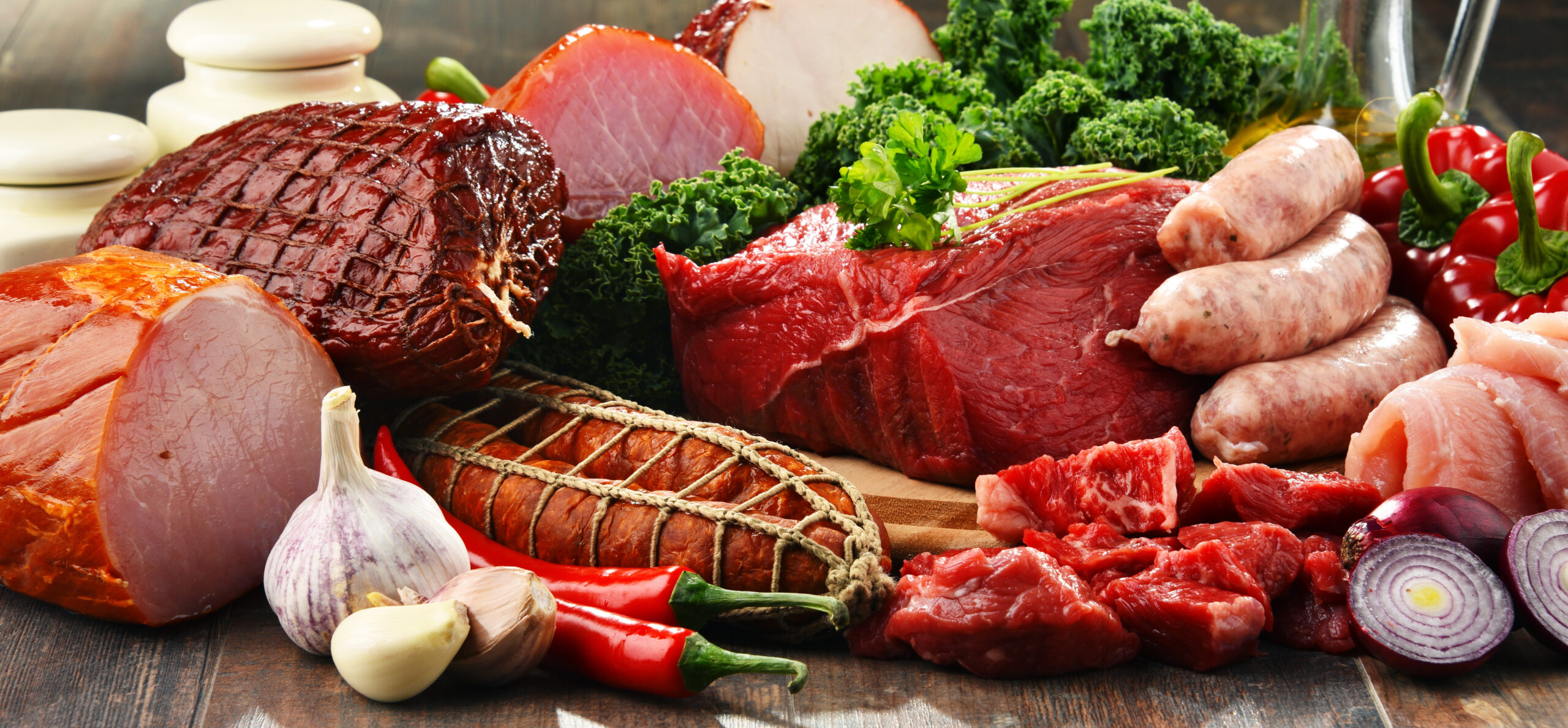 Variety of meat products including ham and sausages
